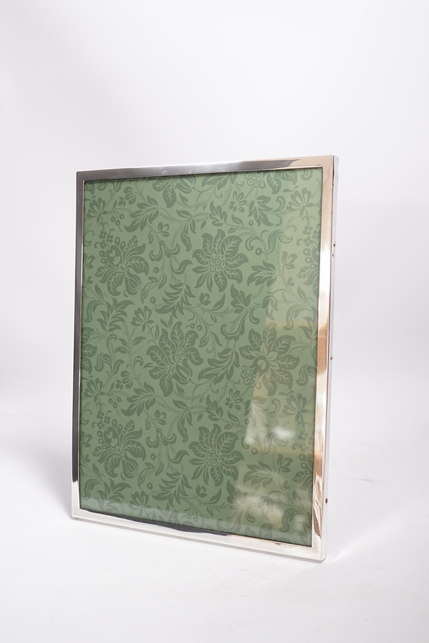 A George V silver mounted rectangular photograph frame, London, 1925, 34.8cm.